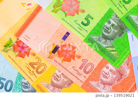 Close up of Malaysian ringgit banknotes cash different denominations Close up of Malaysian ringgit banknotes cash different denominations 139519021