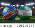 Two soccer balls in flags colors on a stadium blurred background. DR Congo vs Uzbekistan. 3D image. 139519128