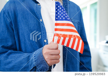 Learn English language, Asian teenage student hold book with flag in course at school. Learn English language, Asian teenage student hold book with flag in course at school. 139520983