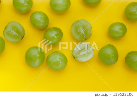 Shine muscat grape on yellow background. 139522106