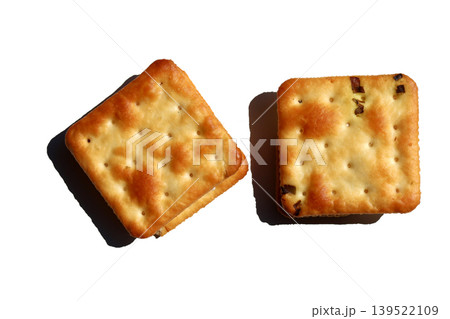Golden crispy crackers isolated on white background Golden crispy crackers isolated on white background 139522109