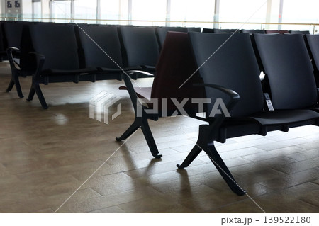 Empty airport waiting chairs near window 139522180