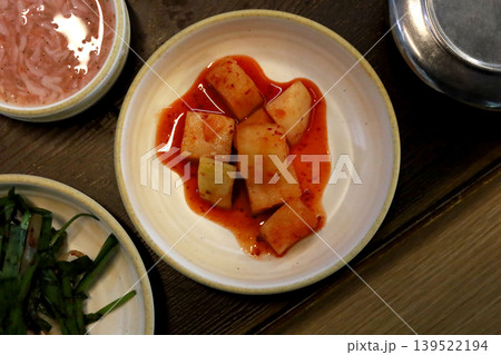 Korean radish kimchi cubes served with spicy sauce Korean radish kimchi cubes served with spicy sauce 139522194