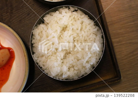 Steamed white rice served in traditional Korean metal bowl Steamed white rice served in traditional Korean metal bowl 139522208