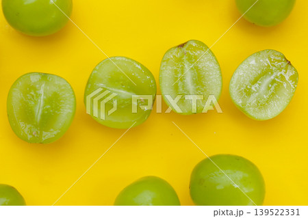 Shine muscat grape on yellow background. Shine muscat grape on yellow background. 139522331