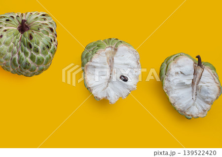 Custard apple fruit on yellow background. Custard apple fruit on yellow background. 139522420