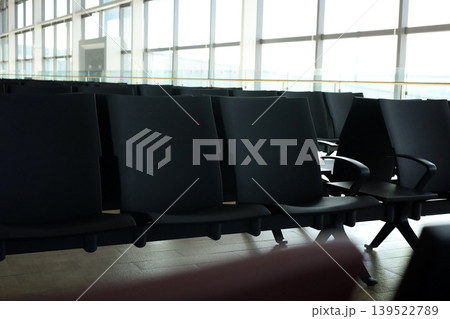 Empty airport waiting chairs near window 139522789