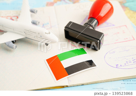 UAE United Arab Emerates passport with approved stamp on document for tourism to immigration at airport in country. 139523868