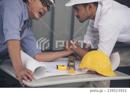 Group of multiracial people Teamwork meeting join hands Engineer Manager Foreman fist bump together. Close up diversity engineer people hands partner teams. Business connection team join partnership 139523932