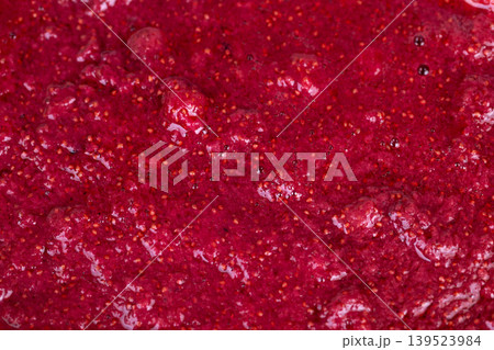 Detailed examination of fresh strawberries showing seed and pulp textures. An upclose perspective highlighting vibrant red color and textured details of freshly picked strawberries Detailed examination of fresh strawberries showing seed and pulp textures. An upclose perspective highlighting vibrant red color and textured details of freshly picked strawberries 139523984