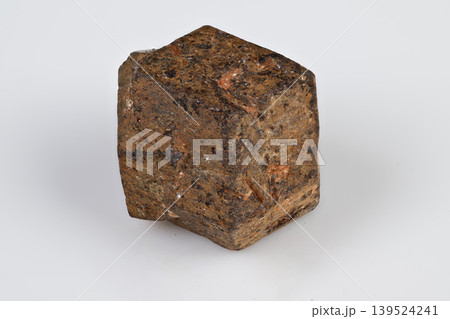 Studiolit macro image of rough garnet crystal with dodecahedral facets. Highresolution detailed photograph of isolated spessartine garnet mineral with textured surfaces Studiolit macro image of rough garnet crystal with dodecahedral facets. Highresolution detailed photograph of isolated spessartine garnet mineral with textured surfaces 139524241