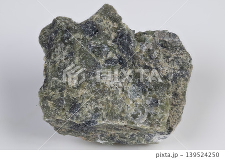 Geological survey sample of green aragonite with sandy matrix. Field collection of green aragonite mineral displaying granular crystalline structure with dark patches Geological survey sample of green aragonite with sandy matrix. Field collection of green aragonite mineral displaying granular crystalline structure with dark patches 139524250