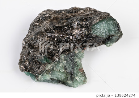 Reflective green stone with contrasting textures and colors. Lustrous malachite pattern with contrasting metallic background and textured surfaces for jewelry craft 139524274