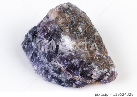 Sparkling mineral specimen. Natural fracture planes reveal crystalline growth. Detailed macro view of violet fluorite showcasing internal structure and natural features Sparkling mineral specimen. Natural fracture planes reveal crystalline growth. Detailed macro view of violet fluorite showcasing internal structure and natural features 139524329