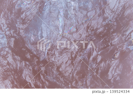 Muted mauve marble wave pattern showing delicate glitter veins and satin sheen across organic mineral surface, minimalist vibe suited for interior and design concept art Muted mauve marble wave pattern showing delicate glitter veins and satin sheen across organic mineral surface, minimalist vibe suited for interior and design concept art 139524334