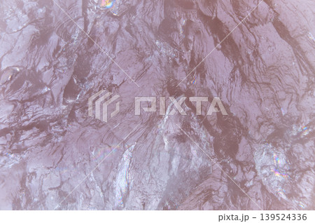 Natural mineral fractures and gentle lighting create calming visual appeal. Smooth rose quartz surface showcasing subtle shimmer and relaxing spainspired atmosphere Natural mineral fractures and gentle lighting create calming visual appeal. Smooth rose quartz surface showcasing subtle shimmer and relaxing spainspired atmosphere 139524336