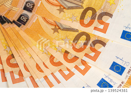 Stacked euro banknotes near retail register visual, layered fifty notes imply pointofsale cash flow, daily sales, and small business earnings in bright composition Stacked euro banknotes near retail register visual, layered fifty notes imply pointofsale cash flow, daily sales, and small business earnings in bright composition 139524381