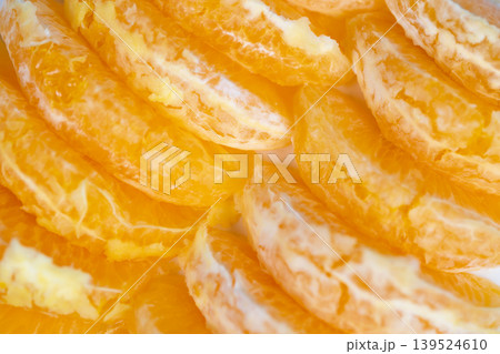 Detailed macro photograph emphasizing orange juice and fibrous tissue. Close examination of vibrant orange segments revealing pulp and succulent juice composition Detailed macro photograph emphasizing orange juice and fibrous tissue. Close examination of vibrant orange segments revealing pulp and succulent juice composition 139524610