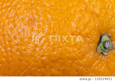 Closeup orange peel texture used in skincare and cosmetology, organic aroma cues and tactile pores for product branding, soft warm tones suggesting oil and exfoliate treatments Closeup orange peel texture used in skincare and cosmetology, organic aroma cues and tactile pores for product branding, soft warm tones suggesting oil and exfoliate treatments 139524651