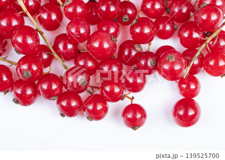 Fresh red currant bunches displayed. Natural red currants with rustic charm. Clusters of organic red currants capturing farm to table natural authenticity and rustic appeal 139525700