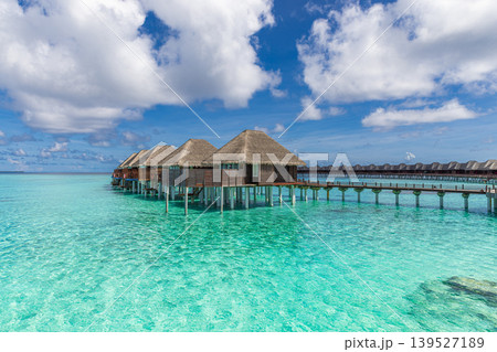 Relaxing Maldives water villa over turquoise ocean, breathtaking sunshine tropical paradise, dreamy luxury overwater retreat, luminous serene island escape 139527189