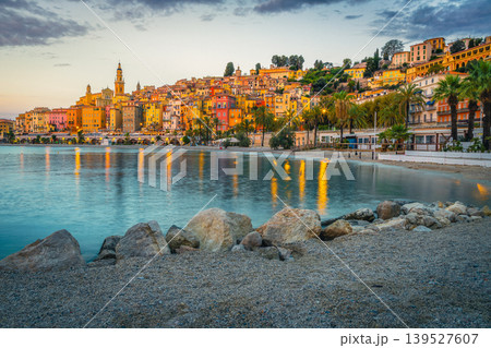 Colorful mediterranean seaside buildings and gravelly beach in Menton, France Colorful mediterranean seaside buildings and gravelly beach in Menton, France 139527607