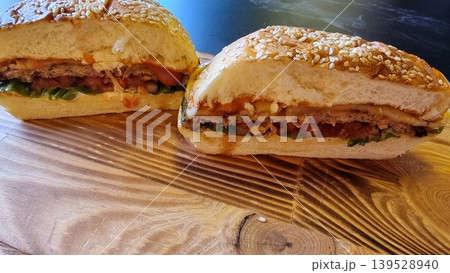 Close-up Shot Of A Burger With Beef On Wooden Surface Close-up Shot Of A Burger With Beef On Wooden Surface 139528940