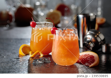 Summer refreshing cocktails with ice, orange and grapefruit juice. Summer refreshing cocktails with ice, orange and grapefruit juice. 139530695