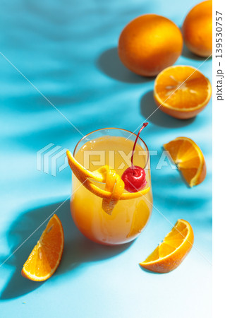 Cocktail Tequila sunrise with orange juice, silver tequila, grenadine, and ice. Cocktail Tequila sunrise with orange juice, silver tequila, grenadine, and ice. 139530757