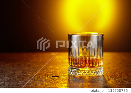 Whiskey on a black stone table. 139530786
