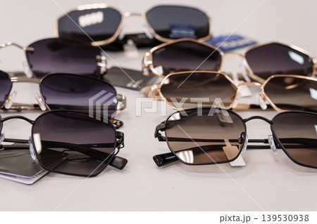 Collection of Various Sunglasses Styles Arranged on White Surface for Fashion Photography 139530938
