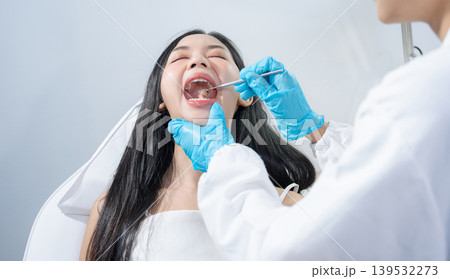 Dentist examining oral health, dental checkup and treatment. Dentist examining oral health, dental checkup and treatment. 139532273