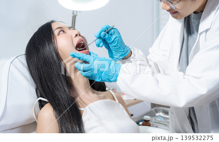 Dentist examining oral health, dental checkup and treatment. 139532275