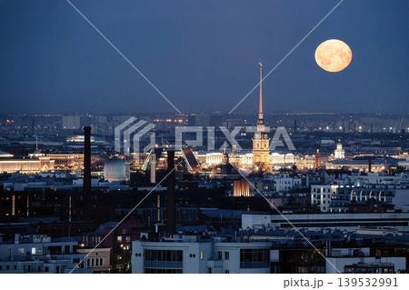 Peter and Paul Cathedral spire rising above St. Petersburg cityscape at night 139532991