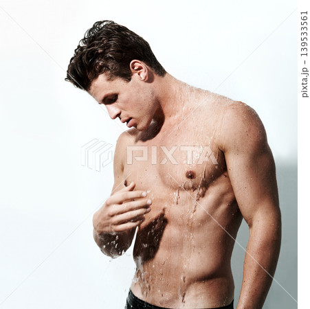 Man in shower to relax, washing skin and body for morning wellness, hygiene and routine. Grooming, skincare and male model with muscle, cleaning and water for self care, health and calm in bathroom. Man in shower to relax, washing skin and body for morning wellness, hygiene and routine. Grooming, skincare and male model with muscle, cleaning and water for self care, health and calm in bathroom. 139533561