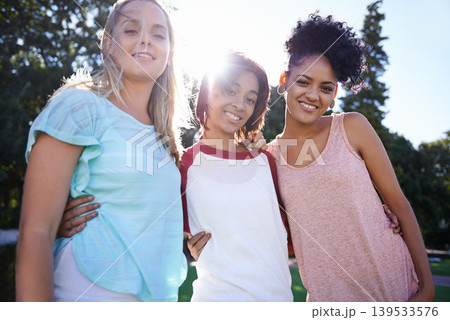 Hug, portrait or friends in park at college, campus or together with happiness, smile or group. University, academy or women bonding with support, joy or solidarity in education in garden together 139533576