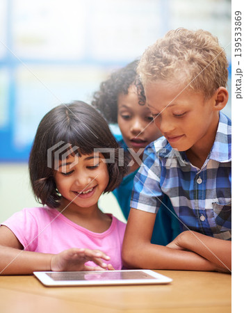Kids, learning and tablet in classroom for online education, scroll on school website and information in group. Happy diversity students or children on digital technology of knowledge and development Kids, learning and tablet in classroom for online education, scroll on school website and information in group. Happy diversity students or children on digital technology of knowledge and development 139533869