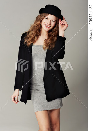 Vintage, fashion and happy portrait of woman with style or aesthetic in grey background of studio. Confident, smile and girl with pride in unique or retro clothing with model in hat for trendy outfit 139534120