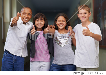 Happy children, portrait and students with thumbs up for success, winning or education at school. Group of young kids smile with like emoji, yes sign or OK for thank you or good job outside classroom Happy children, portrait and students with thumbs up for success, winning or education at school. Group of young kids smile with like emoji, yes sign or OK for thank you or good job outside classroom 139534127