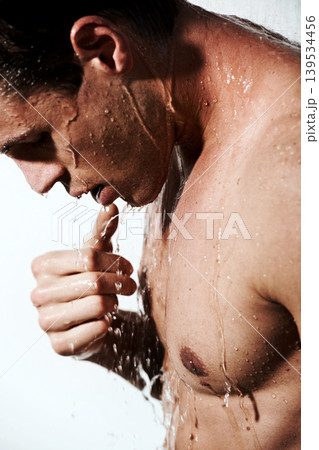 Profile of man in shower to relax, cleaning hair and body for morning wellness, hygiene and skin routine. Grooming, skincare and male model with muscle washing in water, self care and calm bathroom. Profile of man in shower to relax, cleaning hair and body for morning wellness, hygiene and skin routine. Grooming, skincare and male model with muscle washing in water, self care and calm bathroom. 139534456