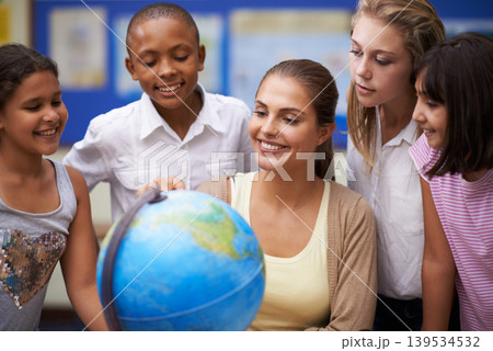 Happy teacher, students and globe of earth in class for education, learning or geography at school. Woman, mentor or educator smile with kids or children with world or planet in classroom together Happy teacher, students and globe of earth in class for education, learning or geography at school. Woman, mentor or educator smile with kids or children with world or planet in classroom together 139534532
