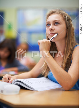 Girl, classroom and learning or thinking on education, writing and notes for knowledge in high school. Female person, book and brainstorming answers for assessment or test, studying and planning Girl, classroom and learning or thinking on education, writing and notes for knowledge in high school. Female person, book and brainstorming answers for assessment or test, studying and planning 139534667