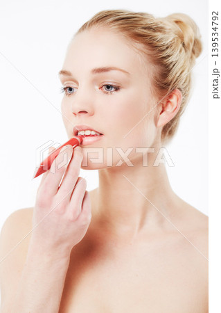 Face, woman or red lipstick for makeup, skincare or beauty cosmetics in studio or white background. Transformation, ready or model with liner product for retouch, makeover or application on mouth 139534792