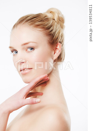 Portrait of model, touching face or skincare for wellness with cosmetics, aesthetic or healthy glow. Facial dermatology, studio or confident woman with pride or beauty results on white background 139534811