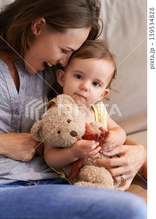Mother, baby and happy in embrace at home, love and together for bonding in childhood. Mommy, daughter and support for toddler in child development, mama and security or connection and teddy bear 139534828