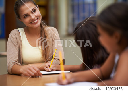 Happy teacher, students and writing in class for education, learning or tutoring at school. Woman, mentor or educator smile for helping kids or children with books in study, library or classroom Happy teacher, students and writing in class for education, learning or tutoring at school. Woman, mentor or educator smile for helping kids or children with books in study, library or classroom 139534884