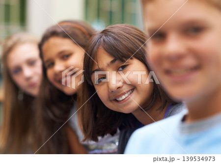 Girl, portrait and confidence in corridor at school or happy and pride for learning, education or knowledge. Student, person or face with smile in building or hallway before class or ready to study Girl, portrait and confidence in corridor at school or happy and pride for learning, education or knowledge. Student, person or face with smile in building or hallway before class or ready to study 139534973