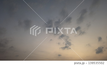 Soft sunrise sky with grey clouds, morning atmosphere, natural dawn light background, peaceful heaven view, dawn scene, orange glow on horizon, cloudy weather. Soft sunrise sky with grey clouds, morning atmosphere, natural dawn light background, peaceful heaven view, dawn scene, orange glow on horizon, cloudy weather. 139535502