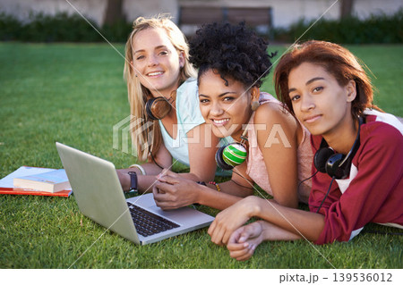 Portrait, laptop or friends on grass at college, campus or together with online course, smile or group. University, relax or happy students bond with support, teamwork or diversity in education Portrait, laptop or friends on grass at college, campus or together with online course, smile or group. University, relax or happy students bond with support, teamwork or diversity in education 139536012