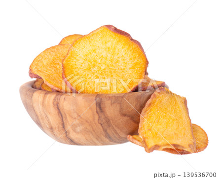 Crispy roasted sweet potato chips with sea salt, isolated on white background. Healthy and crunchy natural vegetable snack. Clipping path. Crispy roasted sweet potato chips with sea salt, isolated on white background. Healthy and crunchy natural vegetable snack. Clipping path. 139536700